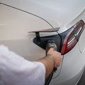 Electric car plugged into a wall-mounted EV charger of a New Zealand family home